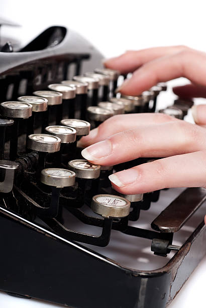 istock fingers on vintage typing machine isolated 176895442