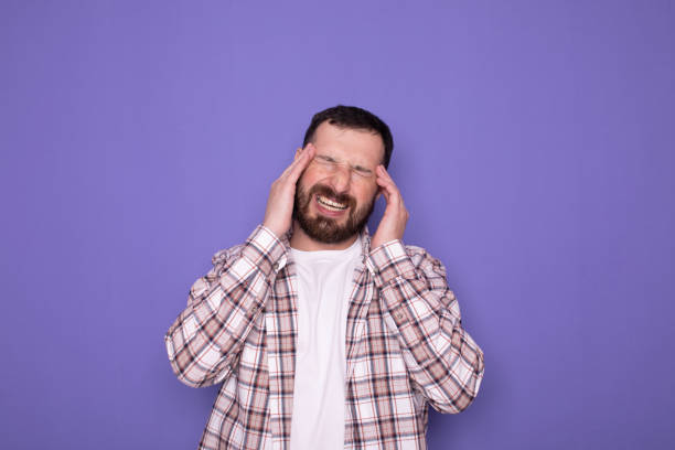 istock Handsome bearded man with head pain. Headache. 1768955323