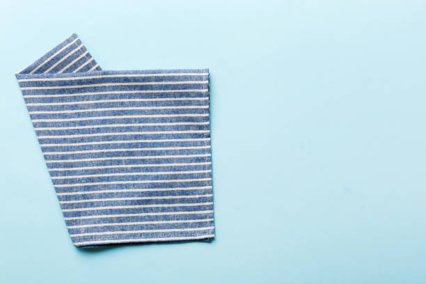 istock top view with blue kitchen napkin isolated on table background. Folded cloth for mockup with copy space, Flat lay. Minimal style 1768962046