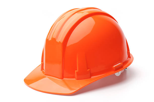 A close-up of a orange hard hat Hard hat, isolated on white background helmet stock pictures, royalty-free photos & images