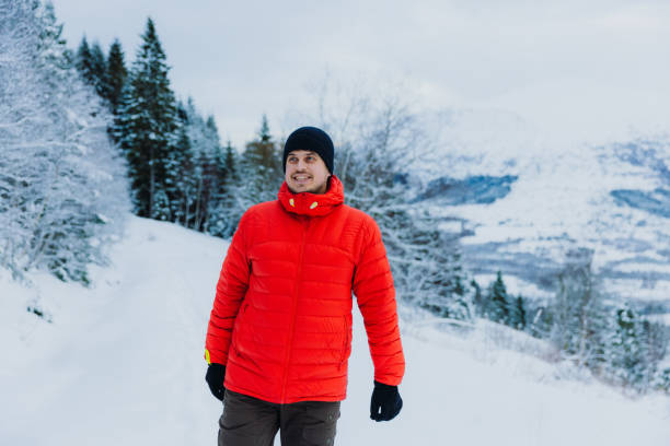 istock Happy Man Admiring Winter Outdoors Hiking in Mountain Forest through Deep Snow 1768967548