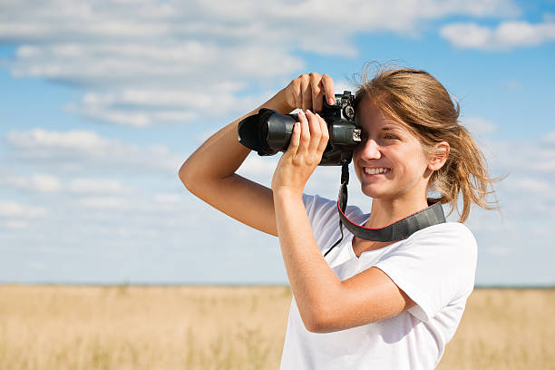 istock girl taking photo 176896758