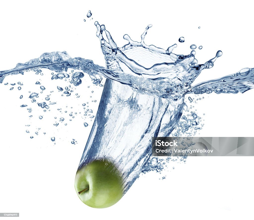 Apple falls deeply under water. Apple falls deeply under water with a big splash. Apple - Fruit Stock Photo