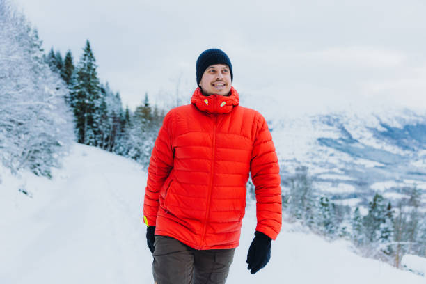 istock Happy Man Admiring Winter Outdoors Hiking in Mountain Forest through Deep Snow 1768970995
