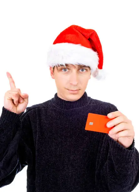 Young Man in Santa Hat with a Bank Card show Finger Up Isolated on the White Background