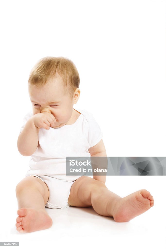 Baby's Чесать его нос - Стоковые фото Младенец роялти-фри