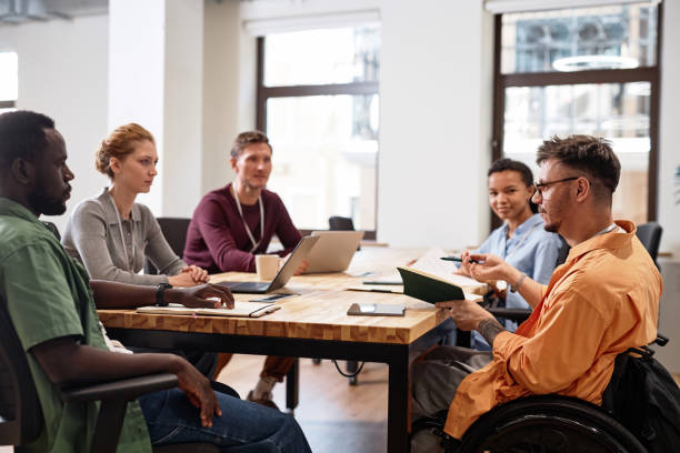 istock Man with disability having meeting with colleagues 1768972599
