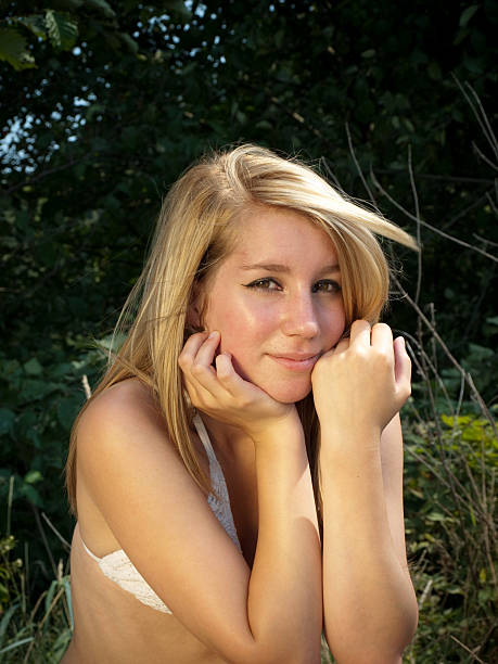 Attractive girl Young woman on pier Sits Relaxing Old Wooden Pier