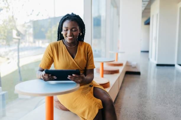 istock Young businesswoman using digital tablet in coworking office space 1768975272