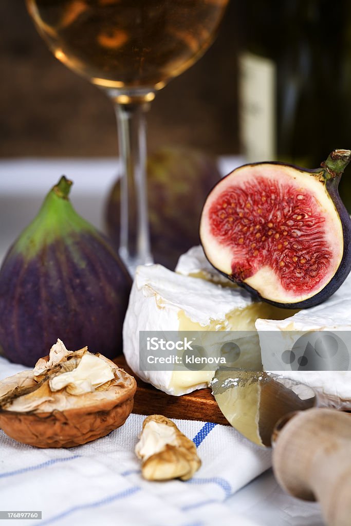 Cheese, figs and white wine "Cheese, figs and white wine on a table" Alcohol - Drink Stock Photo