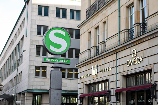 S-Bahn sign on Brandenburger Tor in Berlin, Germany. The S-Bahn is a hybrid urban-suburban rail system serving a metropolitan region predominantly in German-speaking countries. Some of the larger S-Bahn systems provide service similar to rapid transit systems, while smaller ones often resemble commuter or even regional rail systems.