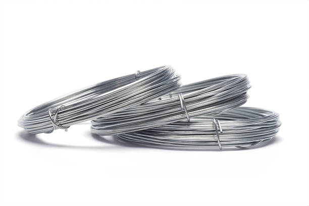 Coils of galvanized wires Coils of galvanized wires lying on white background galvanized stock pictures, royalty-free photos & images