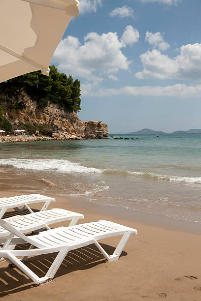 istock Sun chairs on Alonissos sandy beach against Aegean Sea 176898986
