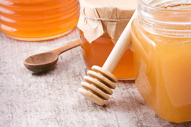 istock glass pot full of honey 176898991