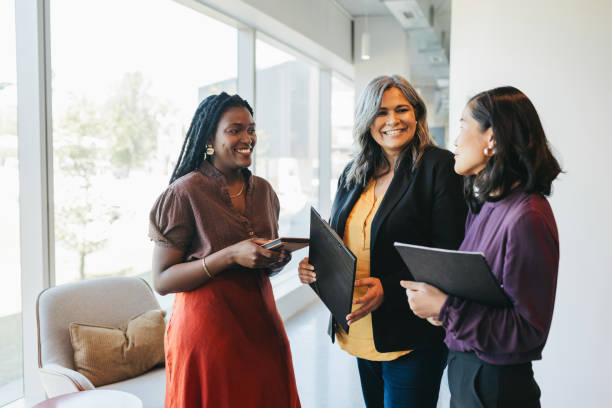 istock Multiracial business partners holding folders, talking in coworking office space 1768990309