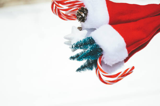 istock Classical reflected image of santas hats full of christmas decoration 1768991314