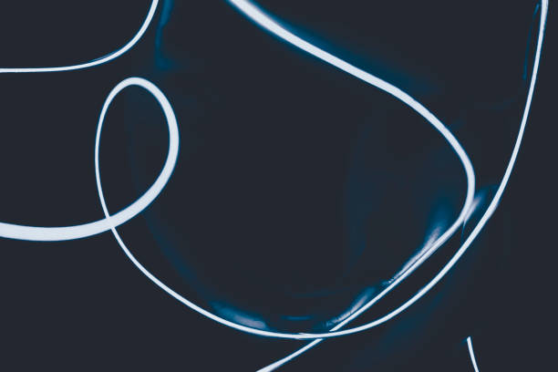 istock Neon light against a black background surrounded a human face in the dark 1768998469