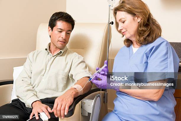 Nurse Giving Patient Injection Through Tube Stock Photo - Download Image Now - IV Drip, Chemotherapy Drug, Patient