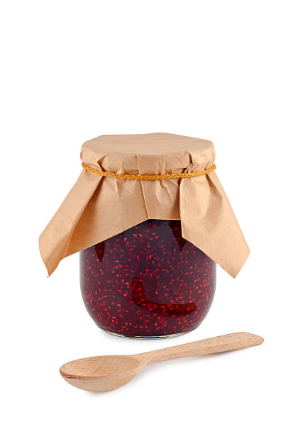 istock Jam in jar, wooden spoon, isolated on white background. 176900596