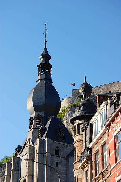 Detail of a old architecture church tower and castle behind stock photo