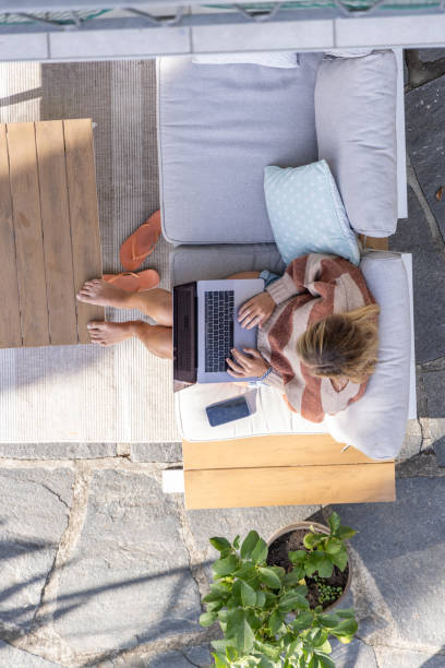 istock High angle view, woman working from home 1769025077