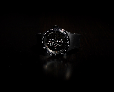 Expensive black watch in the dark