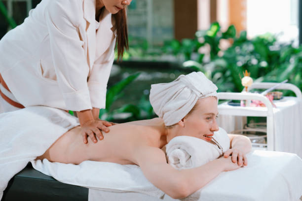 istock Beautiful young woman received a back massage at spa. Side view. Tranquility. 1769035392
