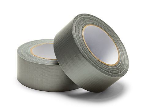 Two Rolls of Grey Duct Tape Cut Out on White.