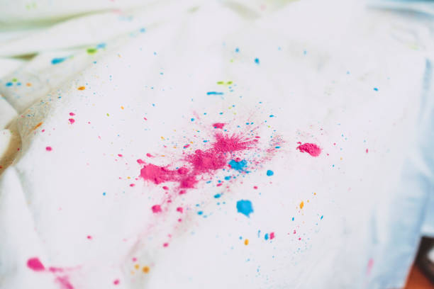 Holi dust splash over a white curtain