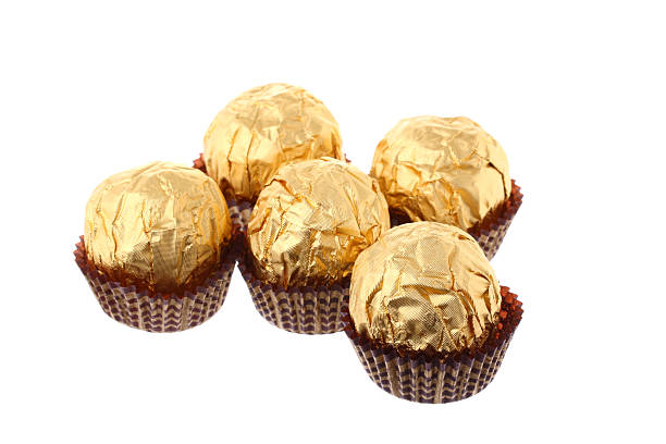 istock Five luxury golden sweets isolated on white 176904883