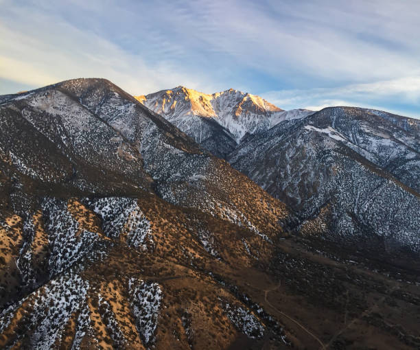 istock Snow-Capped Mountain Peaks at Sunset 1769052640