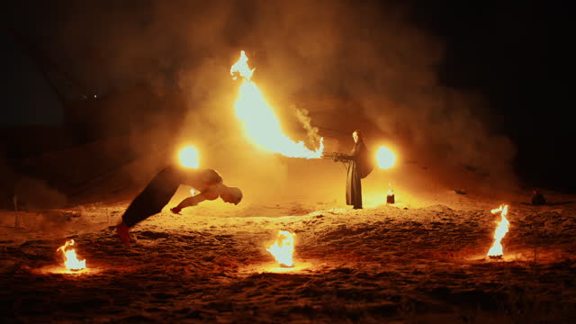 Spectacular Fire Show Outdoors In Night, Cinematic Slow Motion, Stuntman With Torch And Acrobats