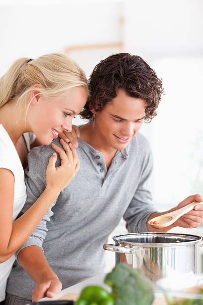 istock A young couple cooking together 176905568