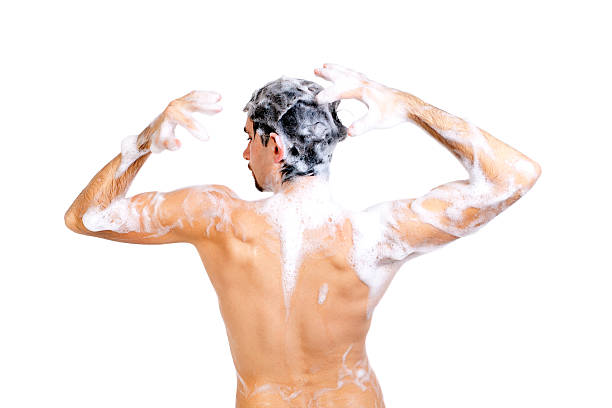 istock Young naked man taking a shower in foam 176905784