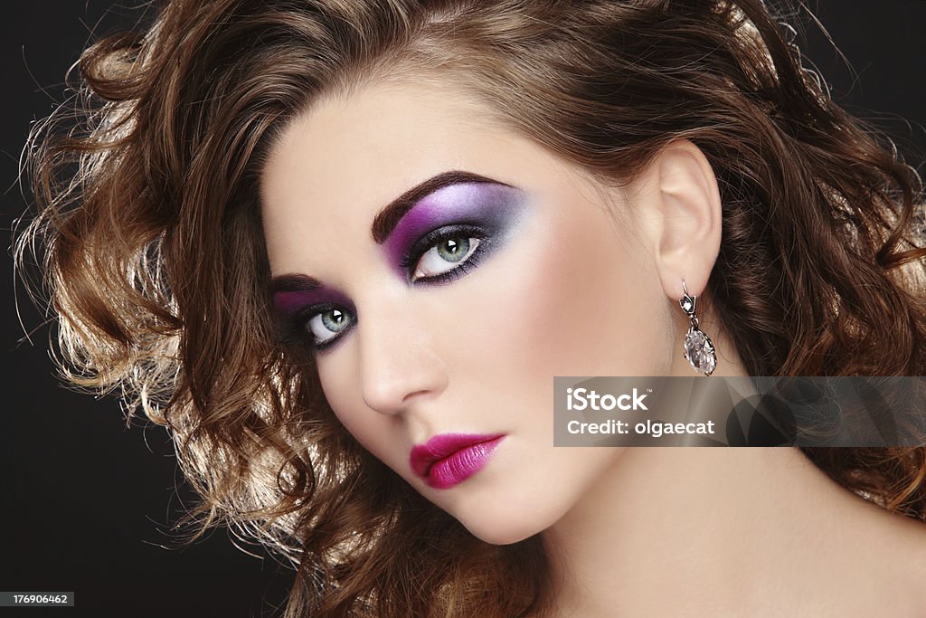 Disco make-up Beautiful young girl with glowing colorful disco make-up and curly hairstyle 1980-1989 Stock Photo