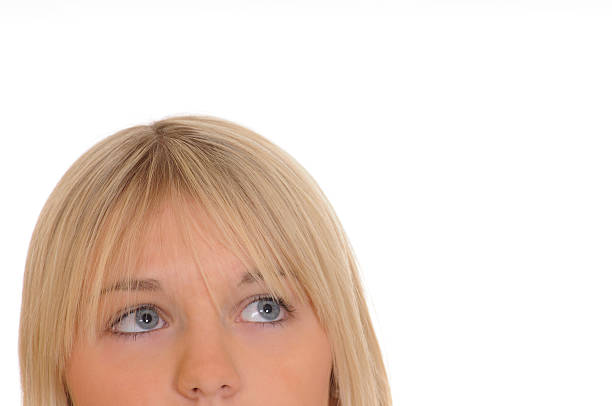 istock blond girl looks up 176907547