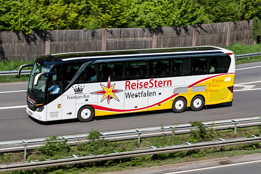 Wiehl, Germany - May 3, 2022: ReiseStern Westfalen Setra S 516 HDH intercity bus on motorway