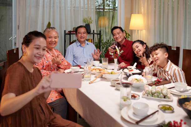 istock Vietnamese Family Posing for Selfie 1769088432