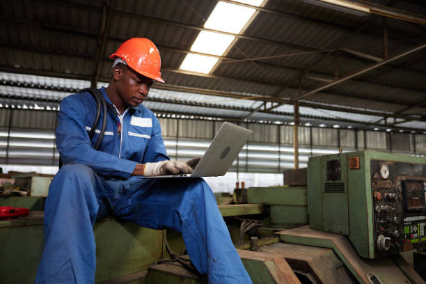 istock male african workers or technician using laptop computer on machine in the factory 1769089523