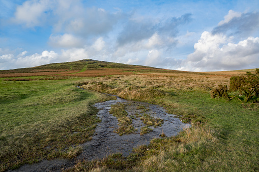 Cox Tor view in Dartmoor with a flowing stream after the rainfall