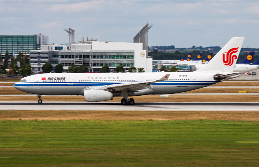 Munich, Germany - July 28, 2015: Air China passenger plane at airport. Schedule flight travel. Aviation and aircraft. Air transport. Global international transportation. Fly and flying.