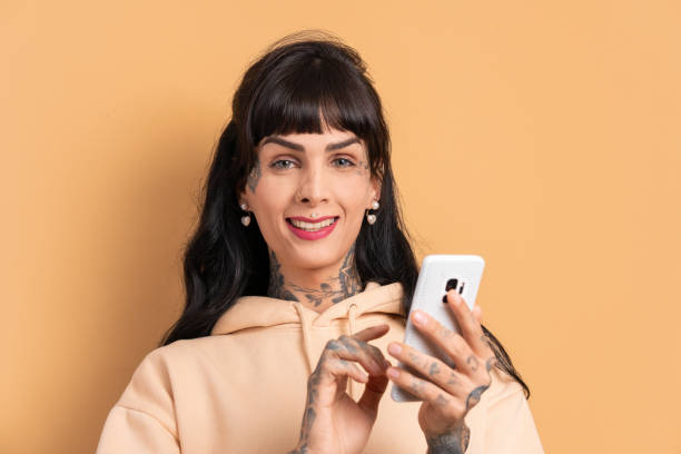 istock cheerful woman texting and typing on the mobile 1769142792