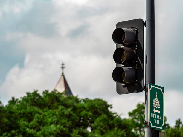 istock Traffic light with historical tour sign attached 1769155937