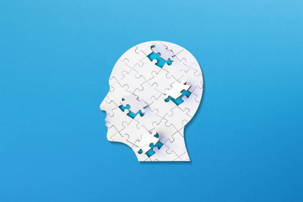 istock Brain shaped white jigsaw puzzle on colored background. Mental health and problems with memory. 1769157021