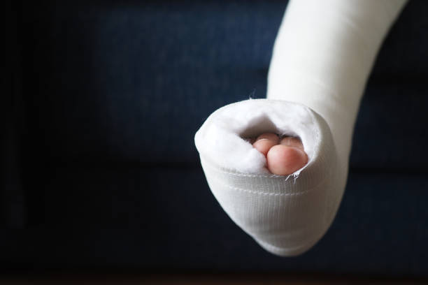 Pain and injury concept. Young man holds bandaged hand. Injured part of body. Medicine and healthcare.