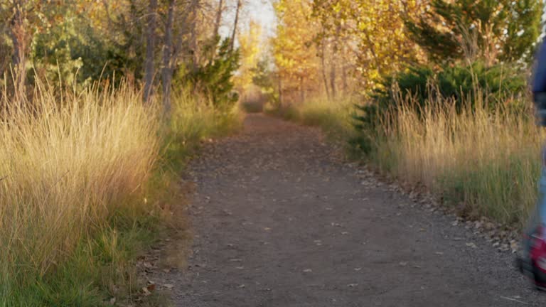 senior male cyclist riding a touring gravel bike on a trail in northern Colorado