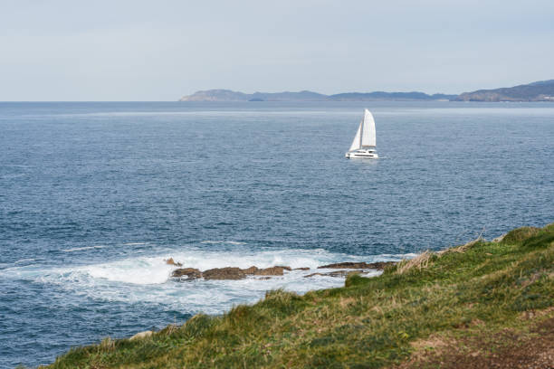 Sailboat on opened sea. Sailing at windy day