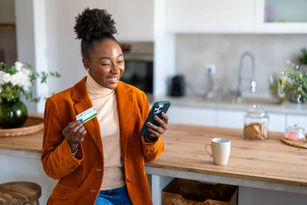 istock Charming young black woman satisfied with good electronic banking services 1769201393