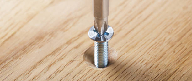 istock screwdriver screw in a wood oaks plank 1769238355
