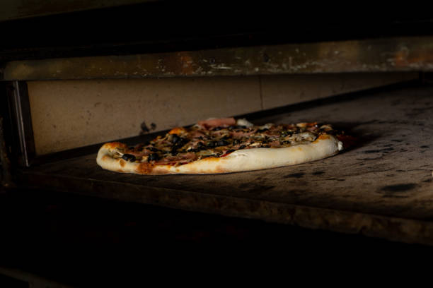 istock Pizzas baking in a pizzeria oven 1769253580
